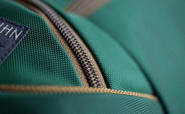 A close shot of the Coyote (brown) zipper and trim of the Guide's Edition Synik 22.